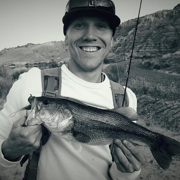 Founder of Bass Unlocked holding a largemouth bass